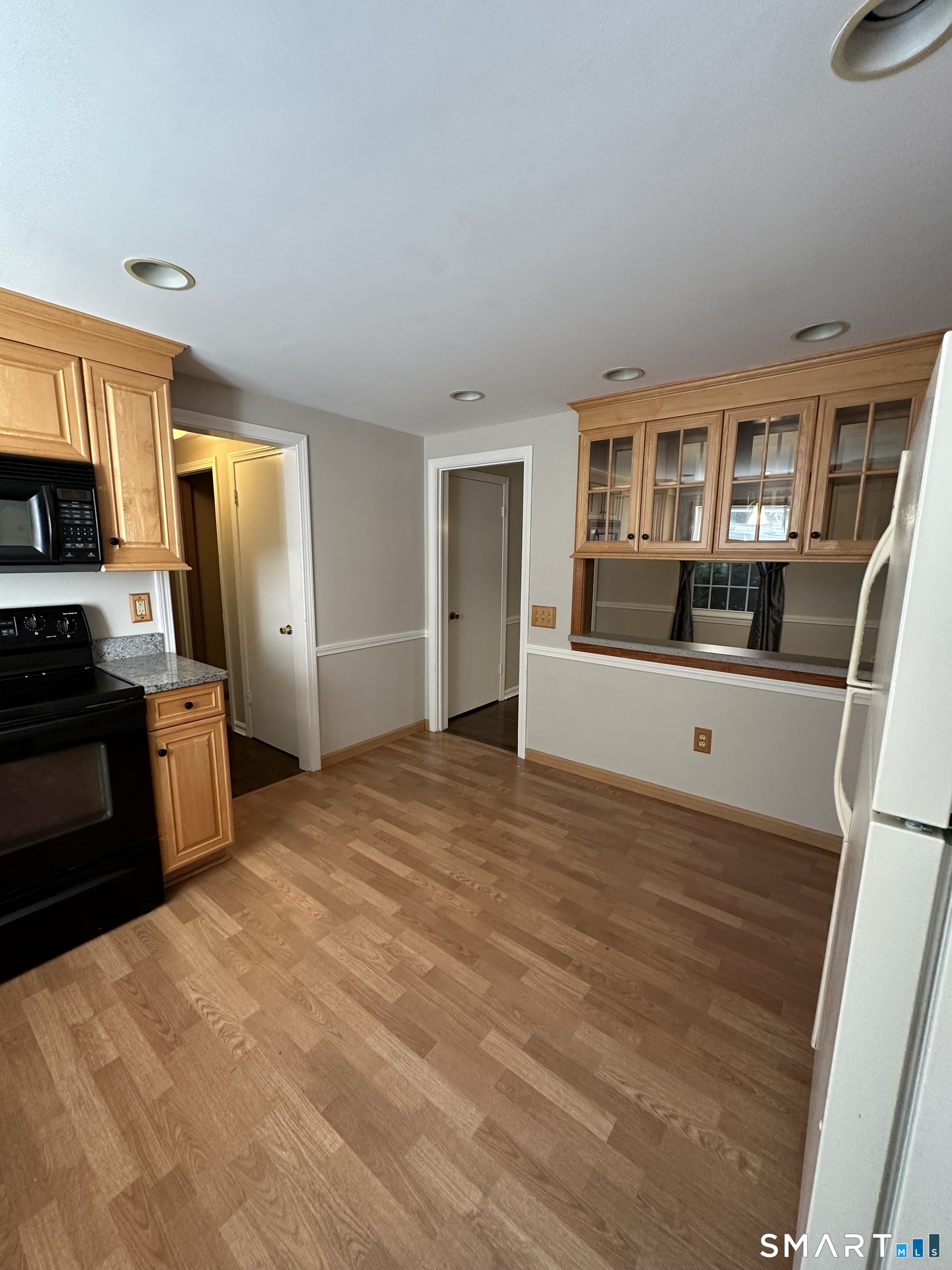 26 South Glenwoods Road Ledyard, CT 06335 - Photo 4 of 12 a bedroom with a bed and wooden floor