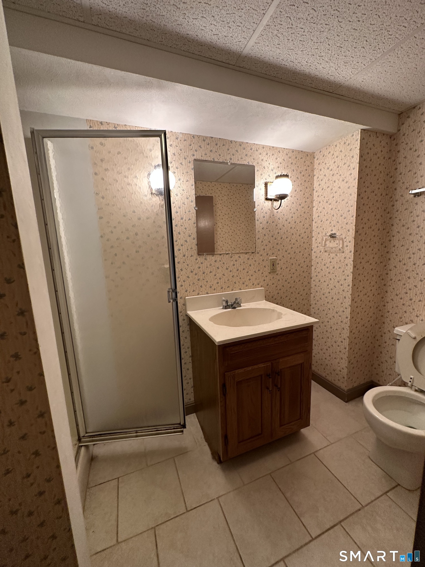 26 South Glenwoods Road Ledyard, CT 06335 - Photo 10 of 12 a bathroom with a sink vanity mirror and toilet