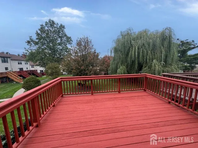 a view of deck with a trees