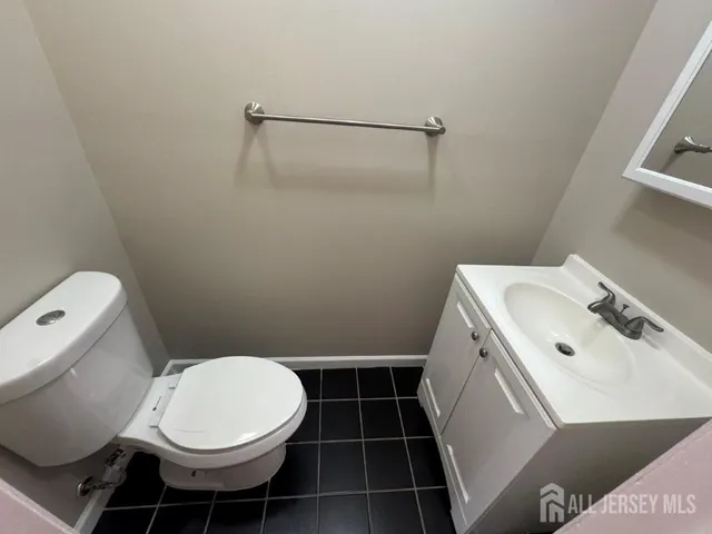 a bathroom with a toilet and a sink