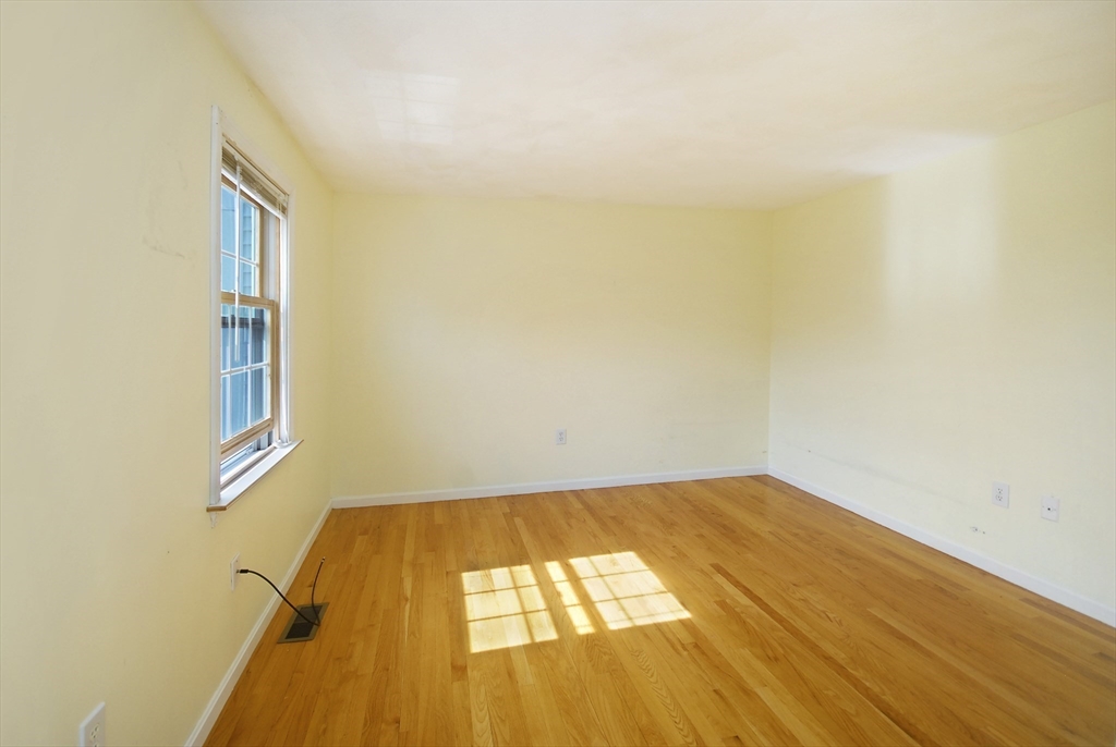 12 Oak Ridge Drive, Unit 4 Maynard, MA 01754 - Photo 17 of 36 a view of a room with wooden floor and white walls