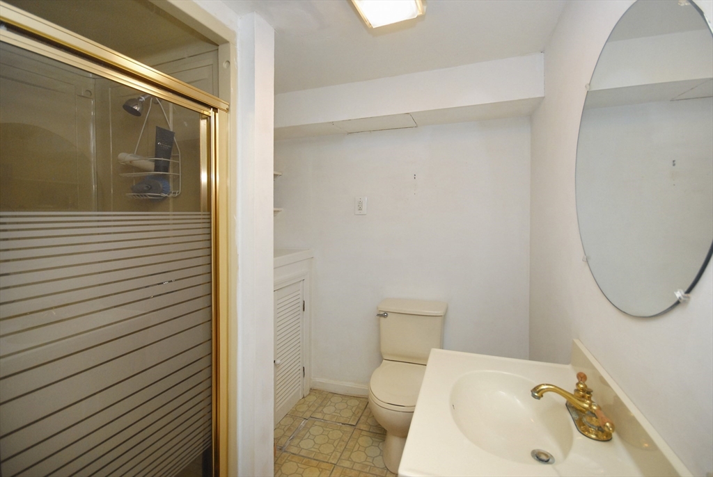 12 Oak Ridge Drive, Unit 4 Maynard, MA 01754 - Photo 26 of 36 a bathroom with a sink and a mirror