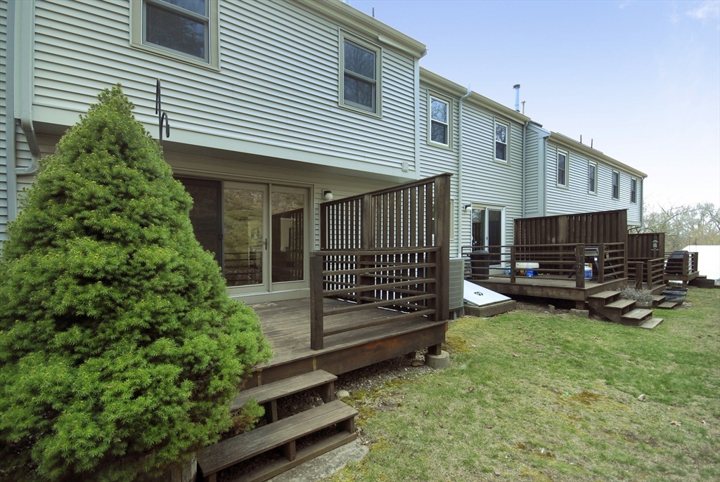 12 Oak Ridge Drive, Unit 4 Maynard, MA 01754 - Photo 29 of 36 a view of a house with backyard and sitting area