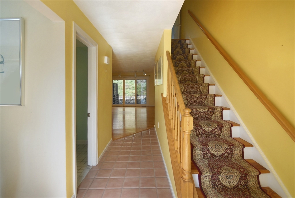 12 Oak Ridge Drive, Unit 4 Maynard, MA 01754 - Photo 3 of 36 a view of a hallway with wooden floor and entryway