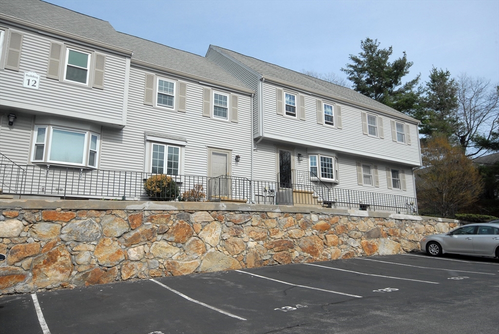 12 Oak Ridge Drive, Unit 4 Maynard, MA 01754 - Photo 33 of 36 a front view of a house with a yard