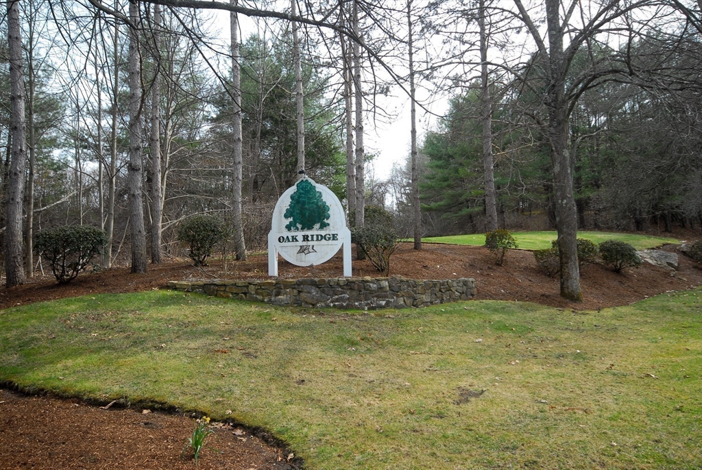 12 Oak Ridge Drive, Unit 4 Maynard, MA 01754 - Photo 36 of 36 a backyard of a house with lots of green space