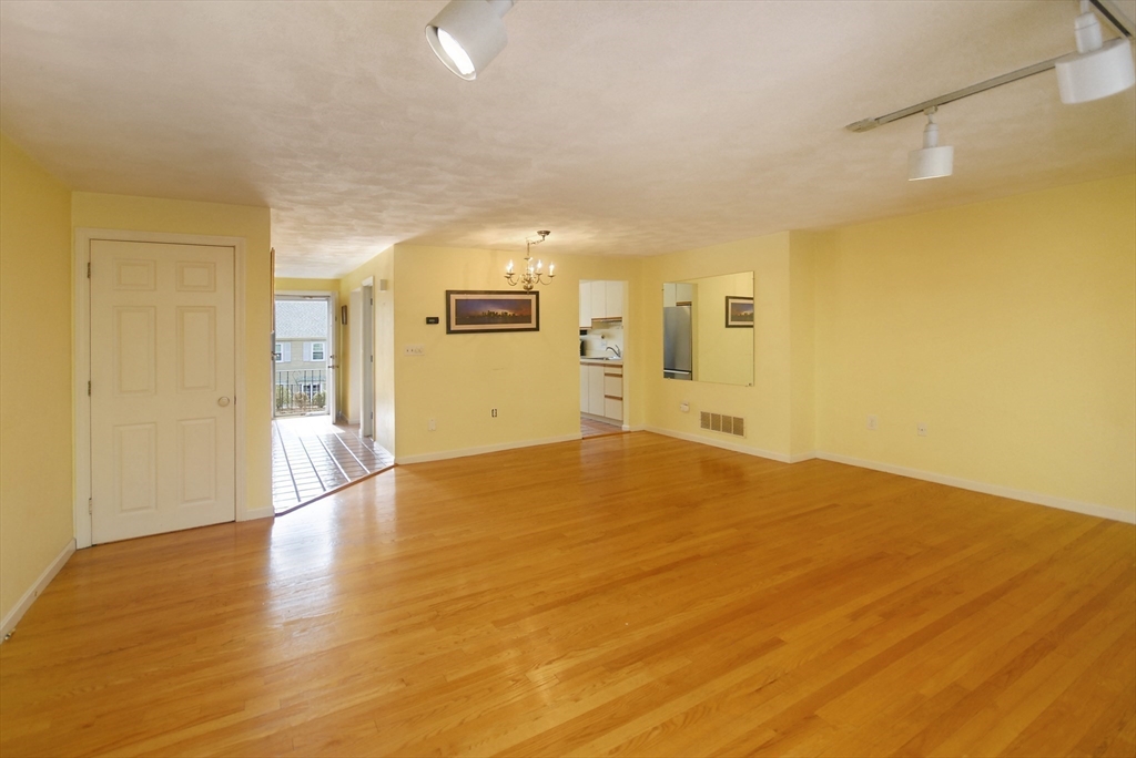 12 Oak Ridge Drive, Unit 4 Maynard, MA 01754 - Photo 9 of 36 a view of empty room with wooden floor