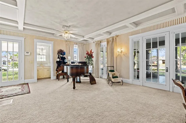 a dining room with furniture and a window