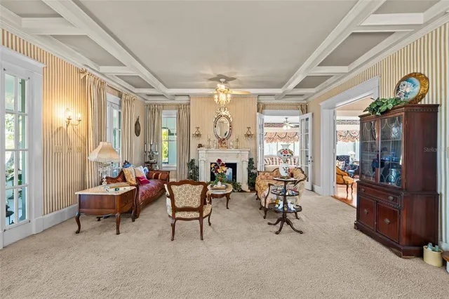 a kitchen with a table chairs refrigerator and cabinets