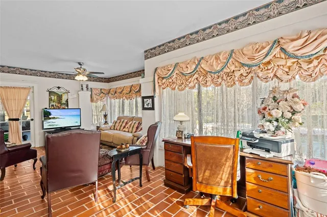 a spacious bedroom with a bed and a fireplace