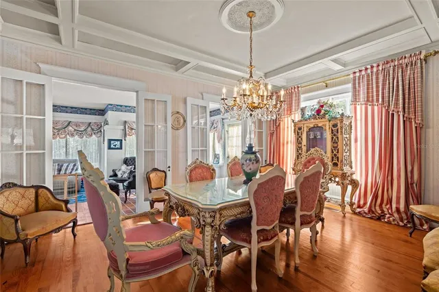 a bedroom with furniture and a large window