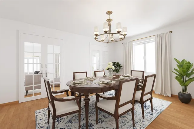 a spacious bedroom with a bed and dresser