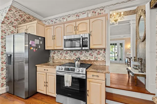 a view of walk in closet with clothes