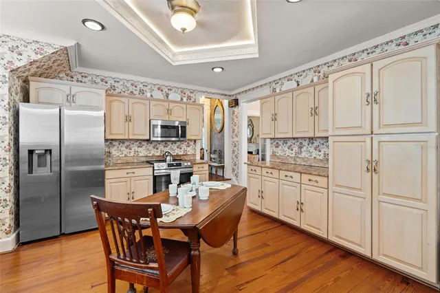 a living room with furniture and kitchen view