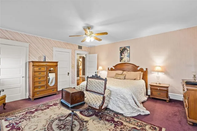 a view of a house with backyard sitting area and garden