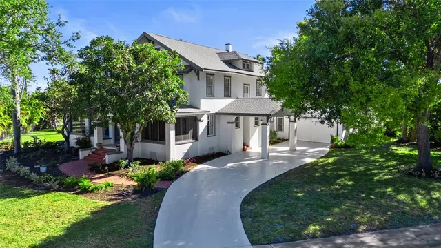 a front view of a house with garden and porch