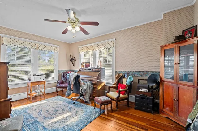 an aerial view of residential house with outdoor space and trees all around
