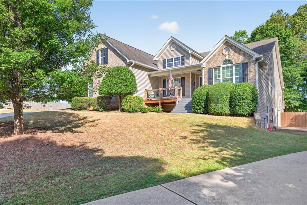 89 Katie Spring Lane Jefferson, GA 30549 - Photo 3 of 63 a front view of a house with a yard