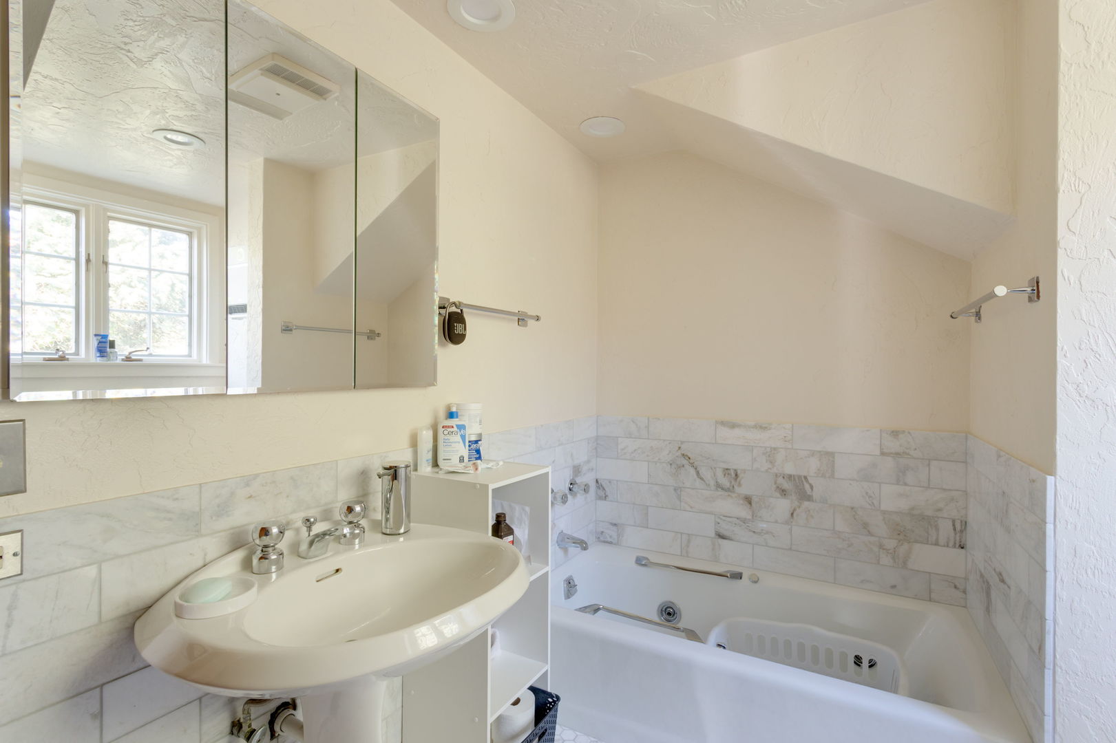 1490 Lake Road Lake Forest, IL 60045 - Photo 28 of 44 a bathroom with a sink a toilet and shower
