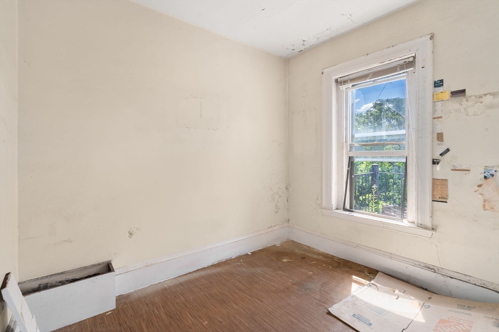 1495 Beacon Street, Unit 3 Brookline, MA 02446 - Photo 17 of 27 a view of a window in an empty room
