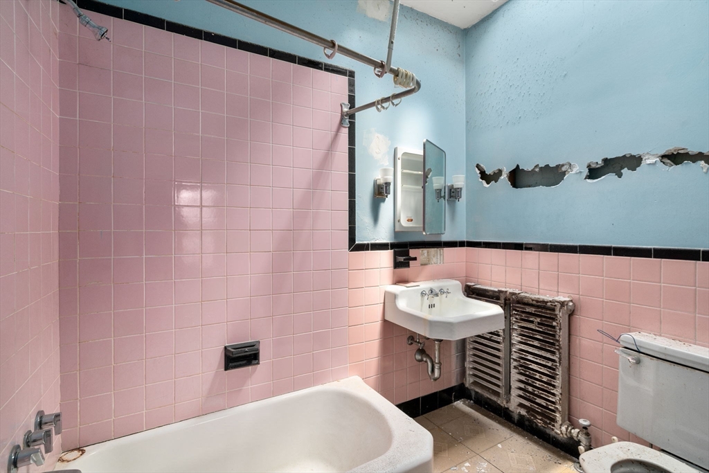 1495 Beacon Street, Unit 3 Brookline, MA 02446 - Photo 18 of 27 a bathroom with a sink and a mirror
