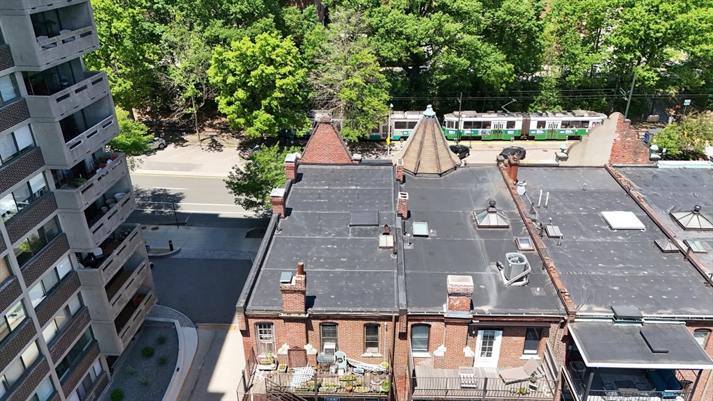 1495 Beacon Street, Unit 3 Brookline, MA 02446 - Photo 4 of 27 an aerial view of residential houses with outdoor space