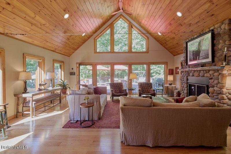 2232 Jacobs Ladder Road Becket, MA 01223 - Photo 13 of 44 a living room with fireplace furniture and a large window