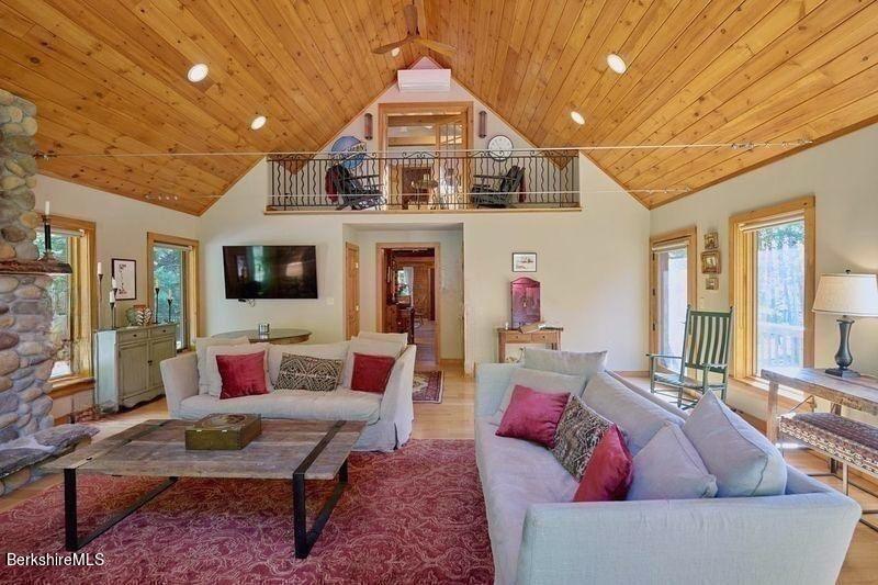 2232 Jacobs Ladder Road Becket, MA 01223 - Photo 15 of 44 a living room with furniture and a flat screen tv