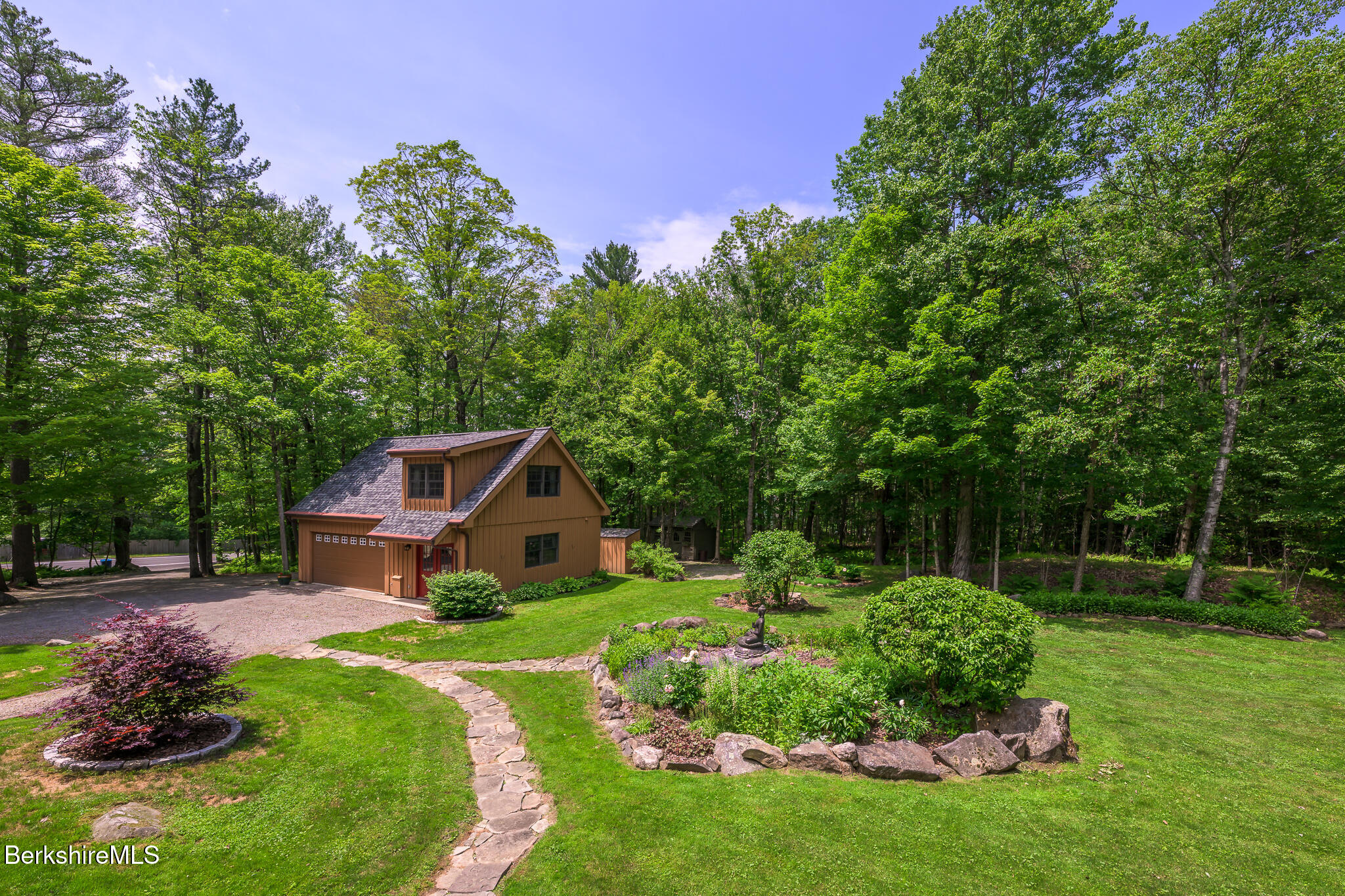 2232 Jacobs Ladder Road Becket, MA 01223 - Photo 22 of 44 a house with green field in front of it