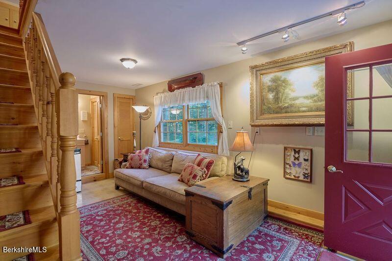 2232 Jacobs Ladder Road Becket, MA 01223 - Photo 25 of 44 a living room with furniture and a large window