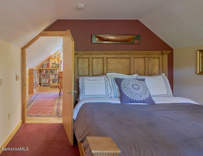 2232 Jacobs Ladder Road Becket, MA 01223 - Photo 28 of 44 a bedroom with a large bed and a balcony view