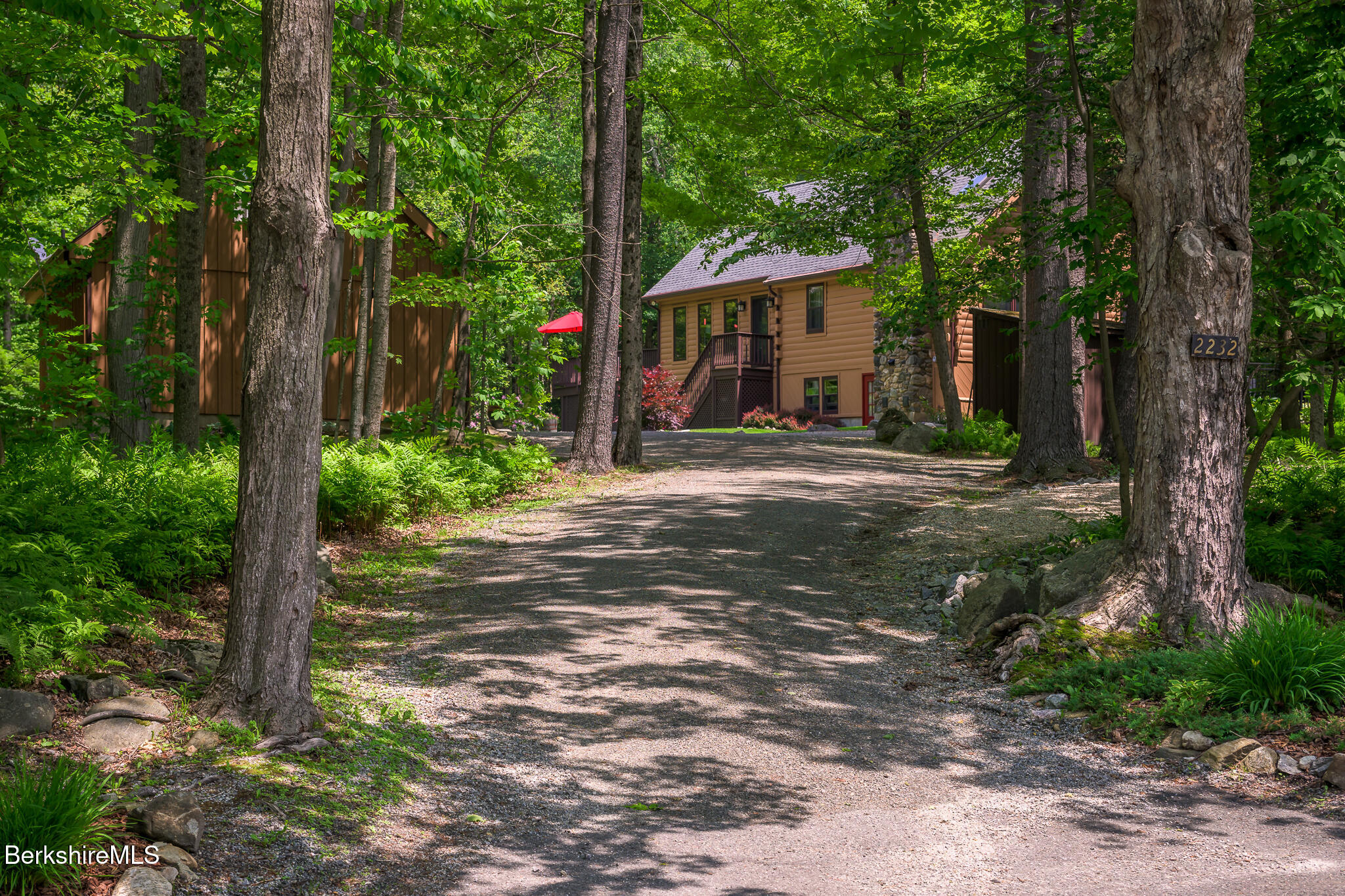 2232 Jacobs Ladder Road Becket, MA 01223 - Photo 42 of 44 a view of a house with a tree in front of it
