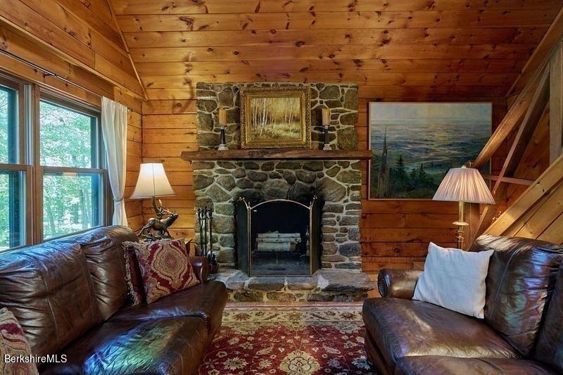 2232 Jacobs Ladder Road Becket, MA 01223 - Photo 7 of 44 a living room with furniture and a fireplace