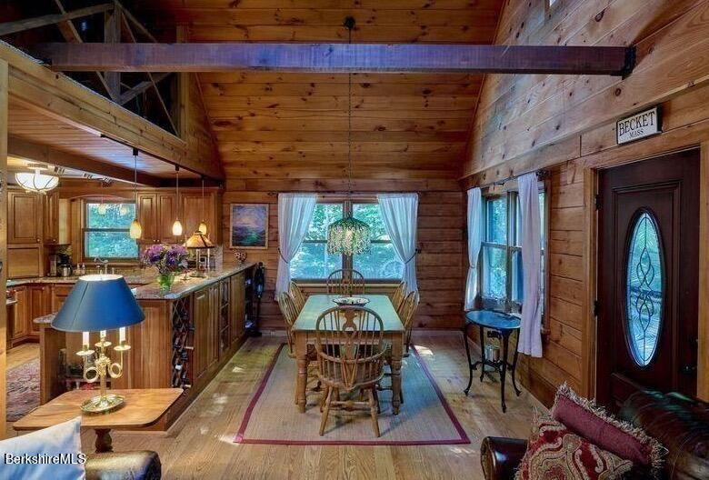 2232 Jacobs Ladder Road Becket, MA 01223 - Photo 8 of 44 a room with lots of furniture and a chandelier