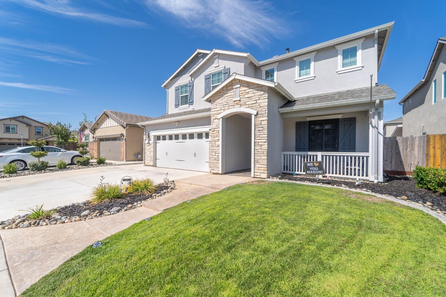 1645 Dedini Lane Ripon, CA 95366 - Photo 1 of 1 a front view of a house with a yard and garage