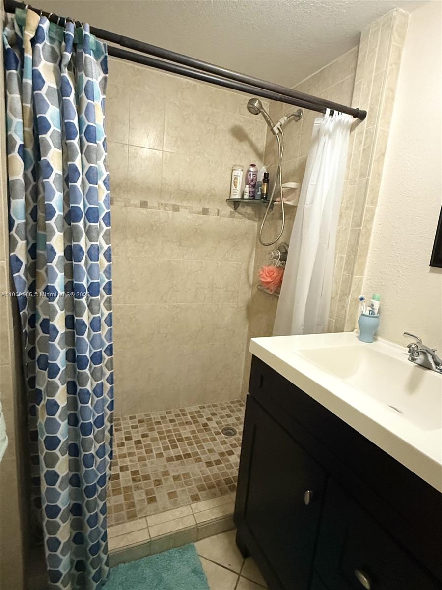 1835 Southwest 10th Street Miami, FL 33135 - Photo 16 of 50 a bathroom with a sink and a shower