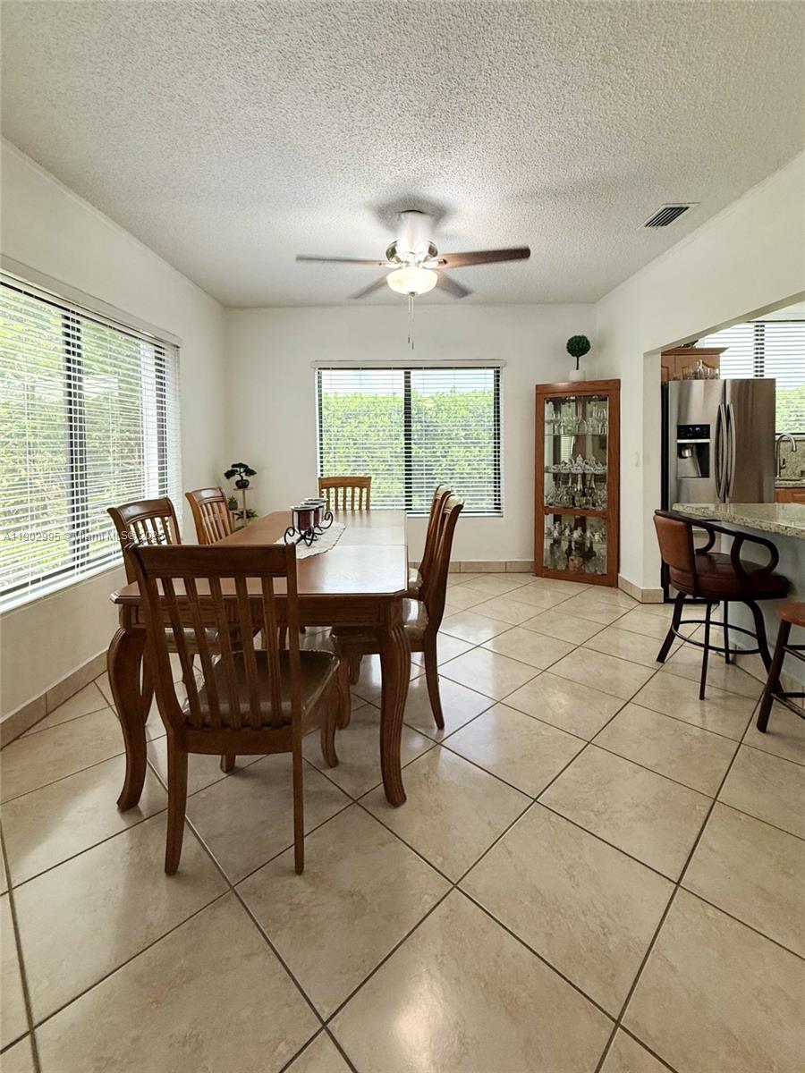 1835 Southwest 10th Street Miami, FL 33135 - Photo 25 of 50 a view of a dining room with furniture window and outside view
