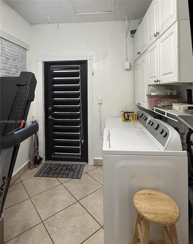 a kitchen with a stove a sink and a refrigerator
