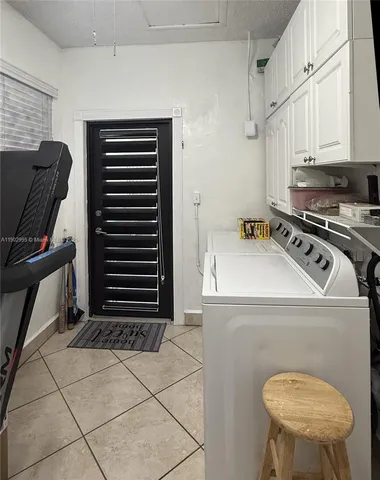 a kitchen with a stove a sink and a refrigerator
