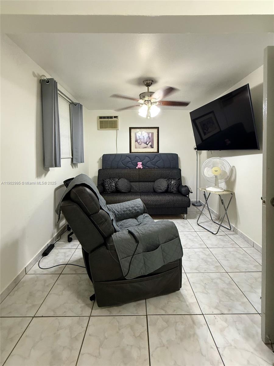 1835 Southwest 10th Street Miami, FL 33135 - Photo 36 of 50 a living room with furniture and a flat screen tv