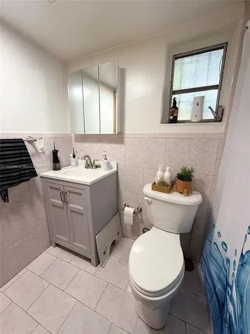 a bathroom with a toilet a sink and bathtub