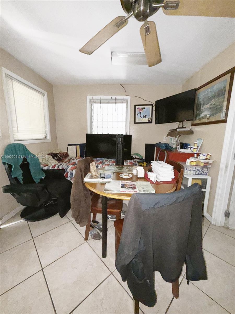 1835 Southwest 10th Street Miami, FL 33135 - Photo 44 of 50 a living room with furniture a flat screen tv and a window