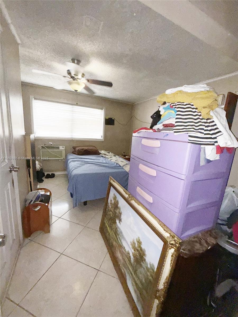 1835 Southwest 10th Street Miami, FL 33135 - Photo 46 of 50 a bedroom with a bed and window