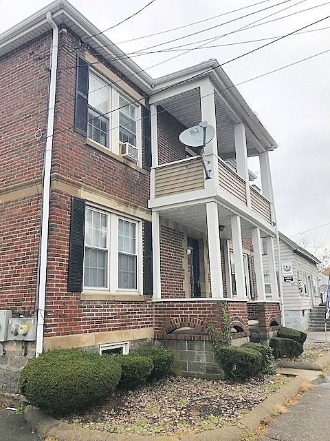 45 Water Street, Unit 2 Quincy, MA 02169 - Photo 2 of 14 a view of a building with a yard