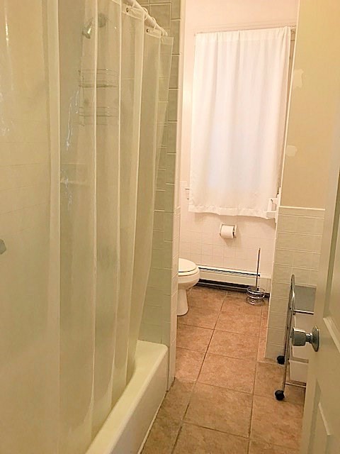 45 Water Street, Unit 2 Quincy, MA 02169 - Photo 6 of 14 a bathroom with a shower and a toilet