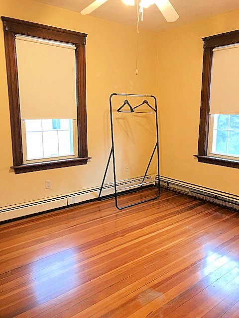 45 Water Street, Unit 2 Quincy, MA 02169 - Photo 7 of 14 a view of an empty room with wooden floor and a window