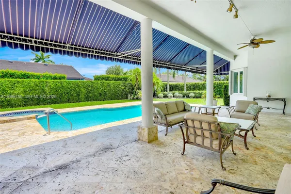 a view of a swimming pool with a patio