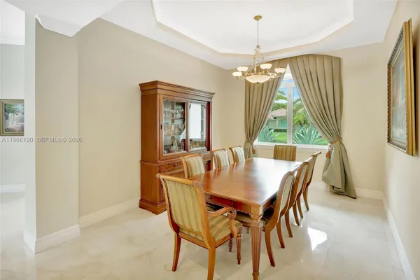 a dining room with furniture and window