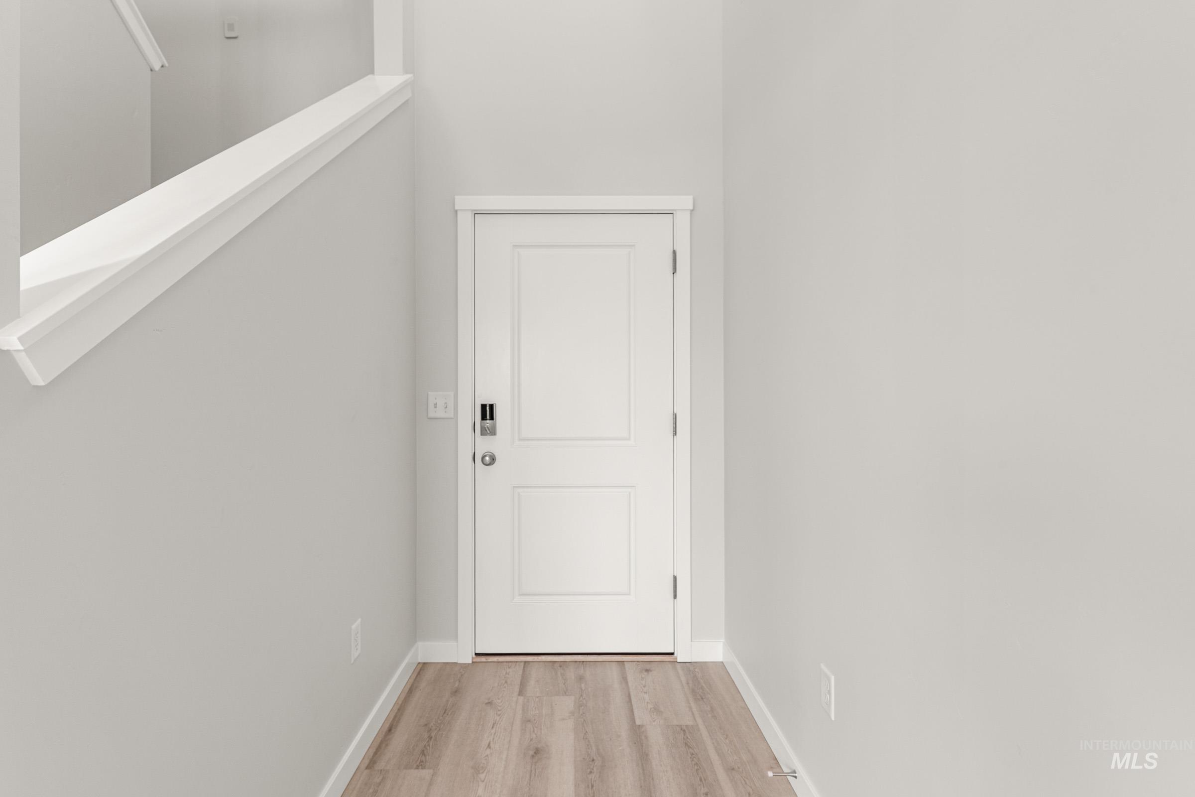 10824 Rutland Street Caldwell, ID 83605 - Photo 2 of 20 Doorway featuring wood finished floors and baseboards