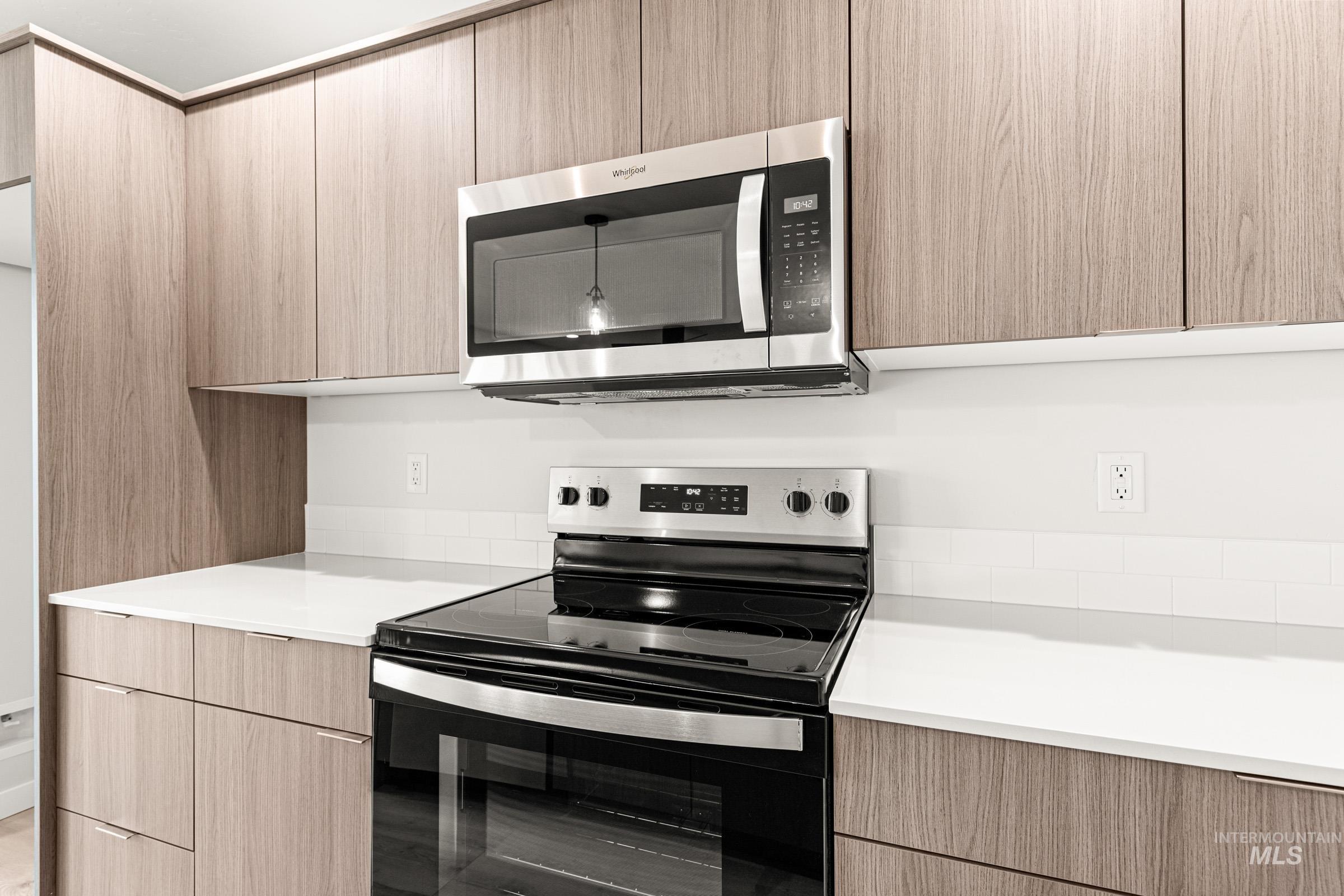 10824 Rutland Street Caldwell, ID 83605 - Photo 7 of 20 Kitchen featuring stainless steel appliances, modern cabinets, and light wood finish cabinets